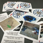 Memory Karten mit geschichtlichen Bildern und Texten und der Germeringer Zierscheibe auf der Rückseite